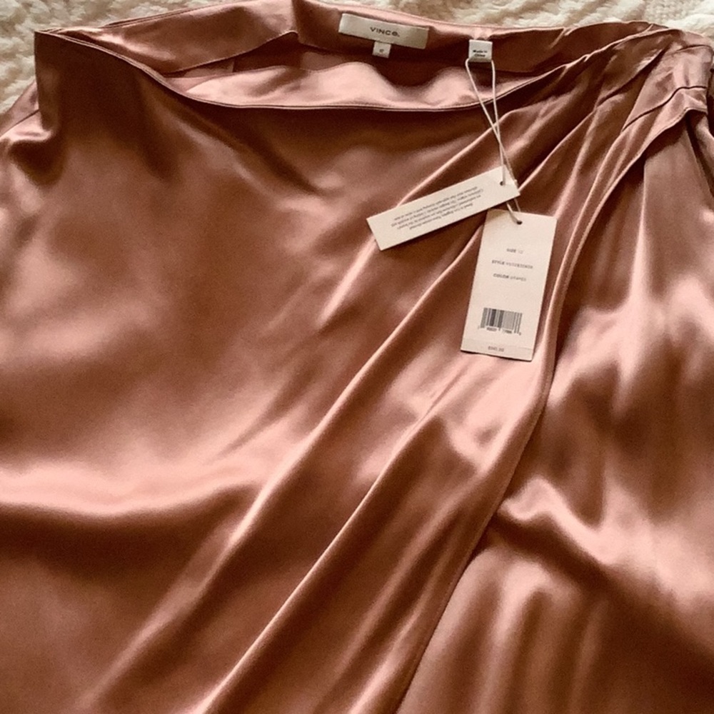 It’s 100% silk light pink shirt.   Brand New from Vince.